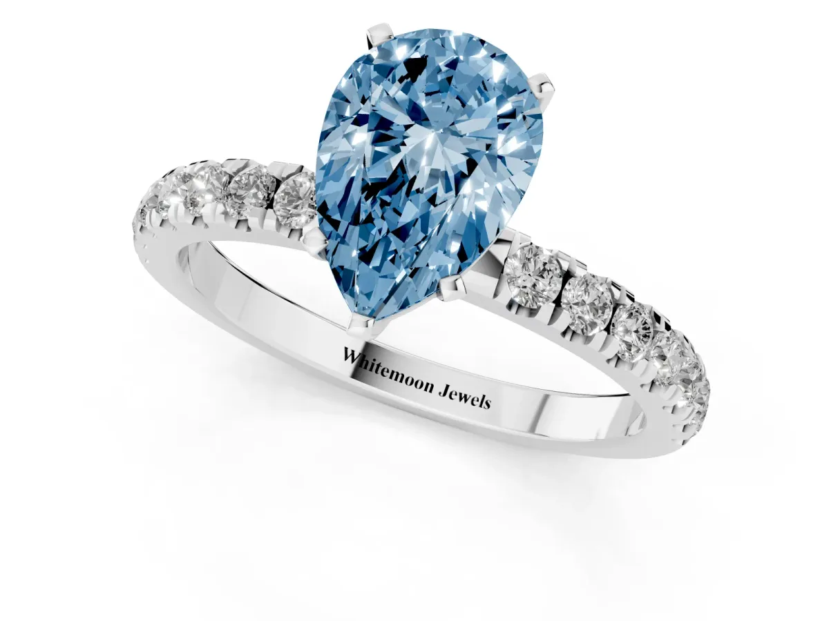 Fancy Blue Pear Cut Diamond Solitaire Ring with Pavé Accents and Four-Prong Setting Platinum