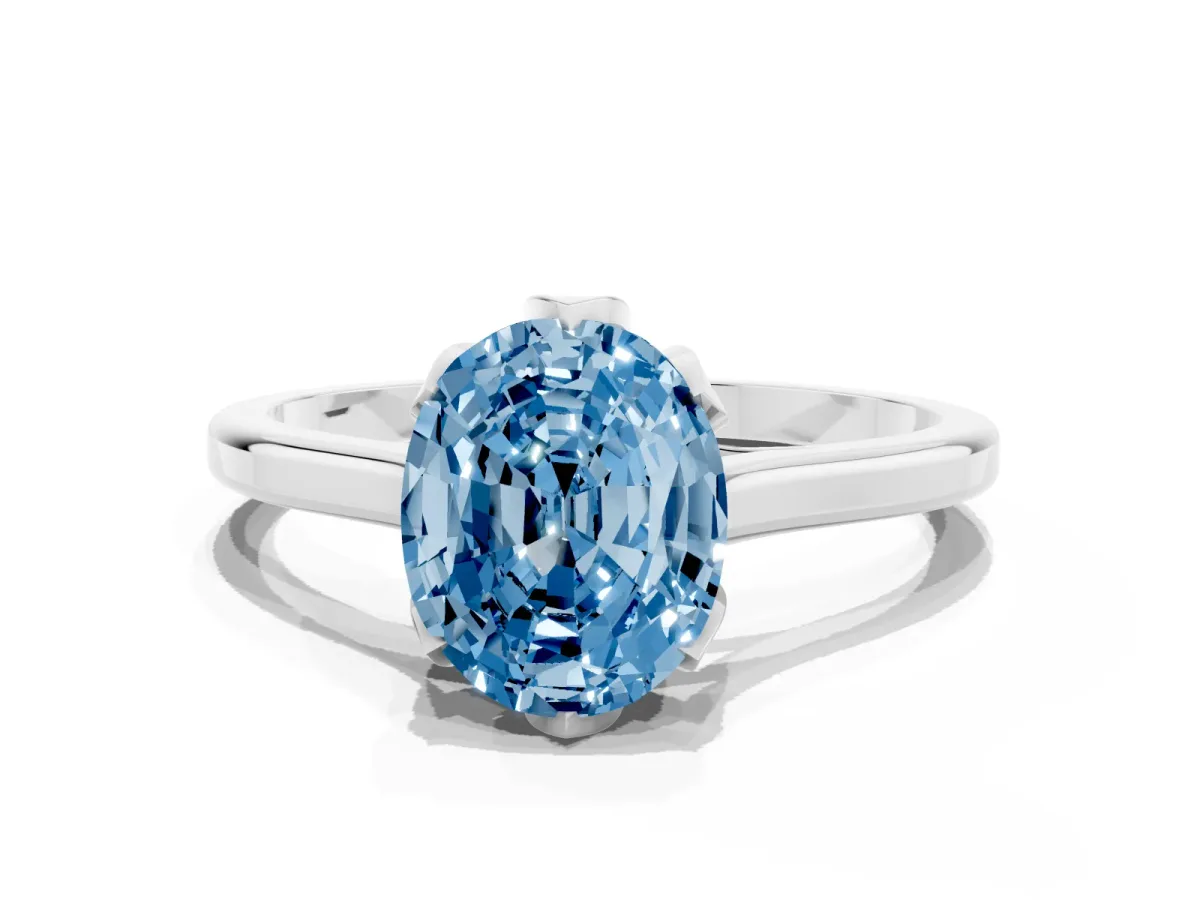 Fancy Blue Oval Cut Diamond Solitaire Ring with Flower Prong Setting and Classic Band Silver
