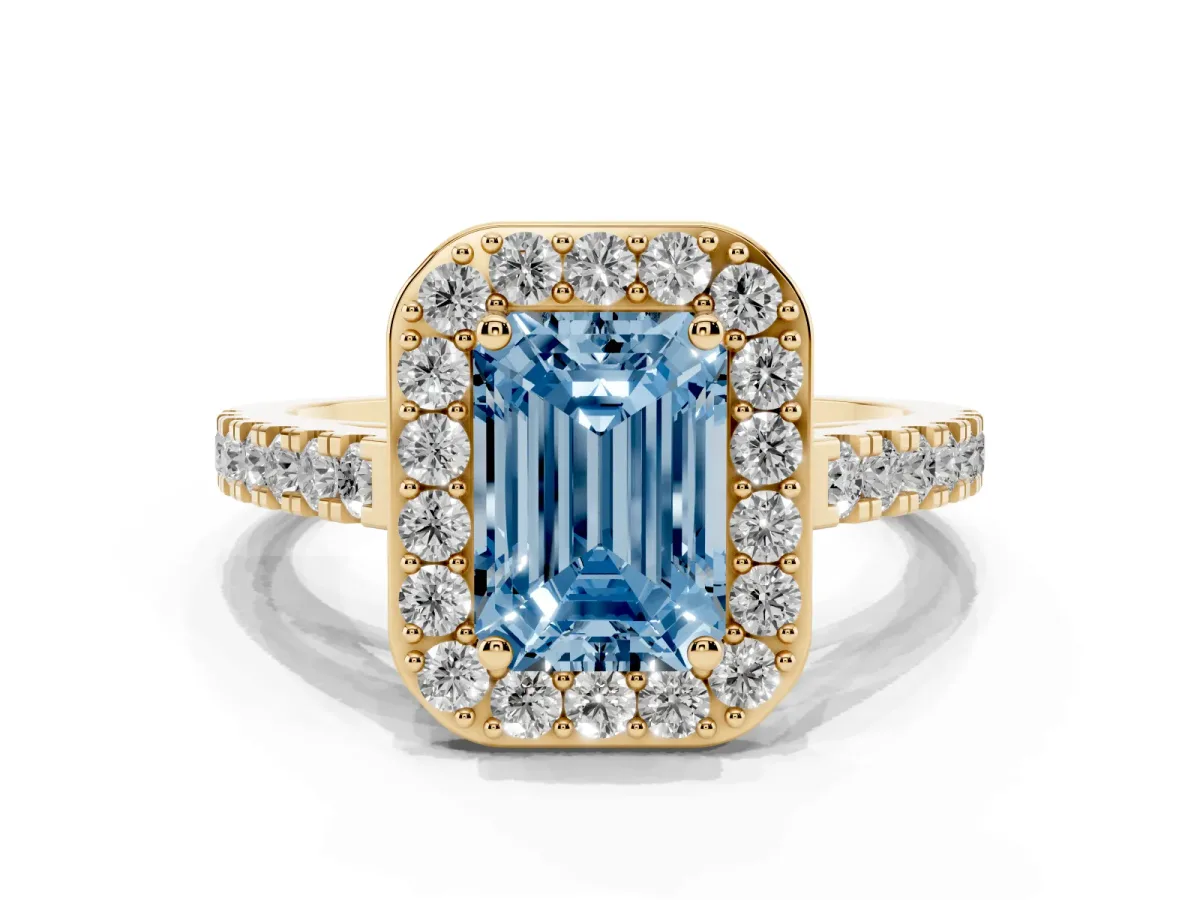 Fancy Blue Emerald Cut Diamond Halo Ring with Round Pavé Split Shank and Prong Setting Yellow gold