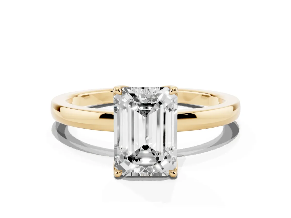 Emerald Cut Diamond Solitaire Ring with Thin Band and Prong Setting Yellow gold