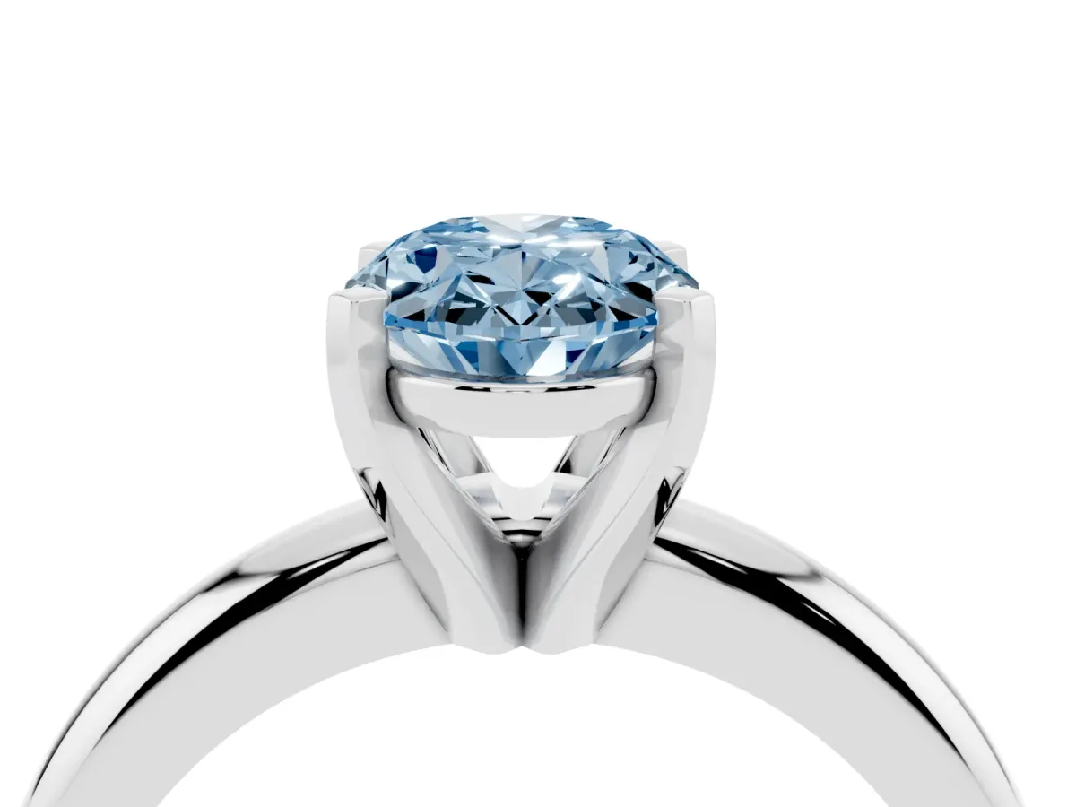 Fancy Blue Oval Cut Diamond Solitaire Engagement Ring with Round Band and Four-Prong Setting Platinum