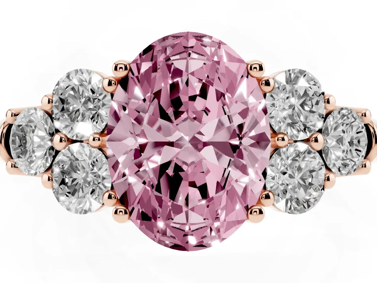 Fancy Pink Oval Cut Cut Diamond Cluster Ring with Round Accent Stones and Prong Setting on a Classic Band Rose gold