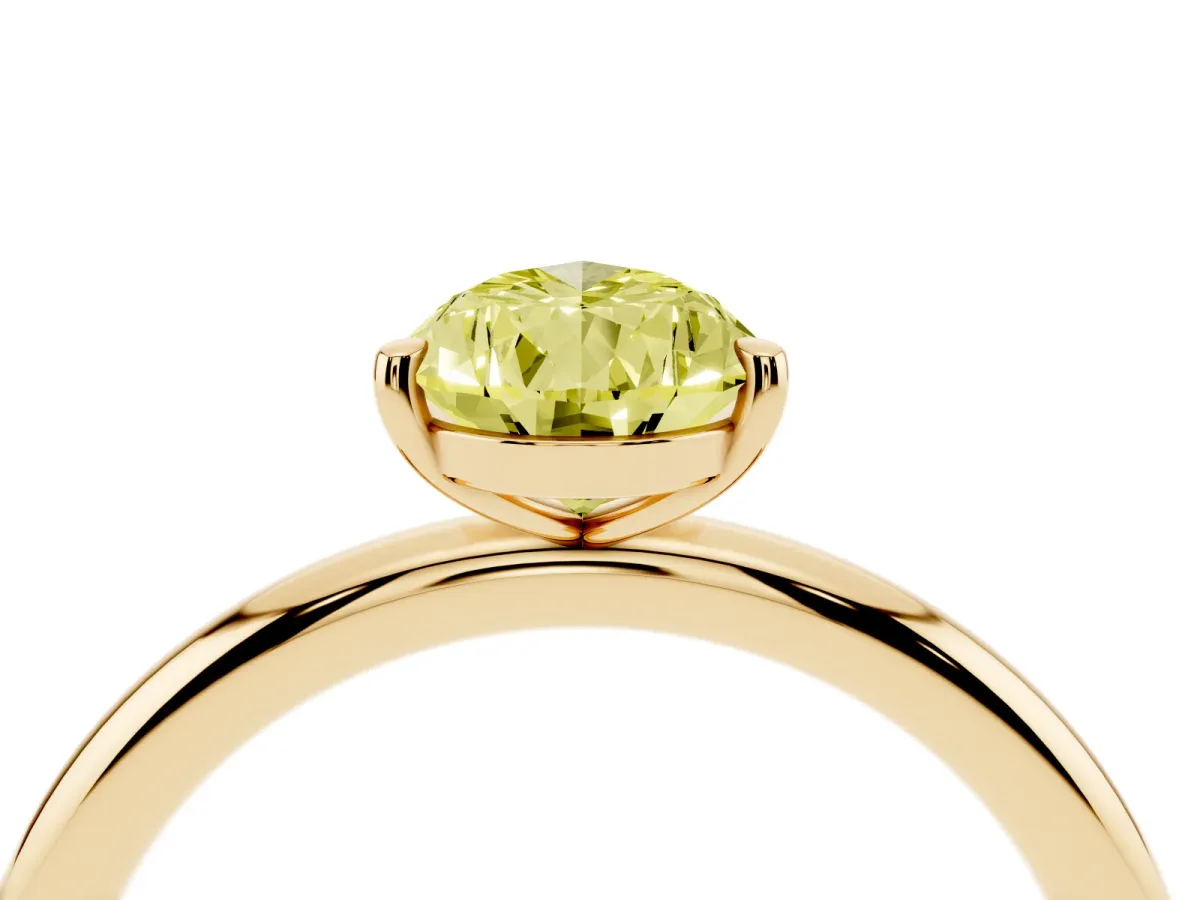 Fancy Yellow Pear Cut Solitaire Diamond Ring with Four-Prong Setting on a Plain Band Yellow gold