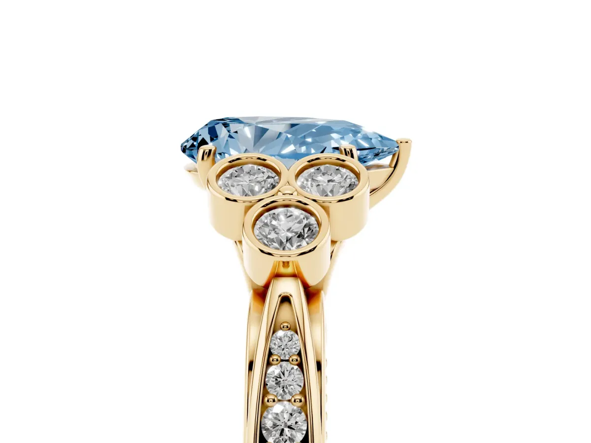Fancy Blue Pear Cut Cut Diamond Engagement Ring with Bezel Set Round Side Stones and Prong Setting Yellow gold