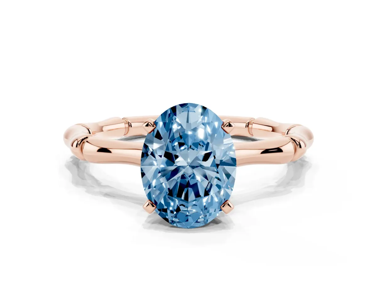 Fancy Blue Oval Cut Solitaire Diamond Ring with Bamboo Band and Four-Prong Setting Rose gold