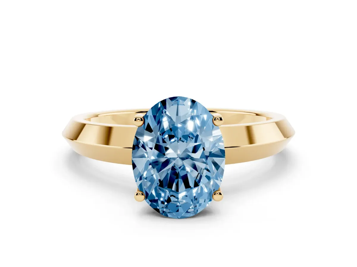 Fancy Blue Oval Cut Cut Solitaire Engagement Ring with Flat Band and Four-Prong Setting Yellow gold