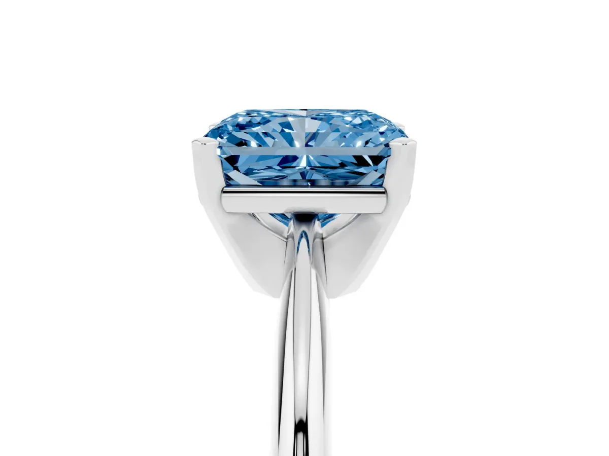 Fancy Blue Radiant Cut Cut Solitaire Ring with Four-Prong Setting on a Classic Band Silver