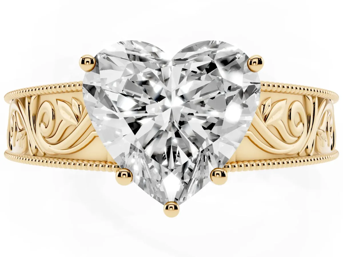 Heart Cut Diamond Solitaire Ring with Engraved Band and Four-Prong Setting Yellow gold