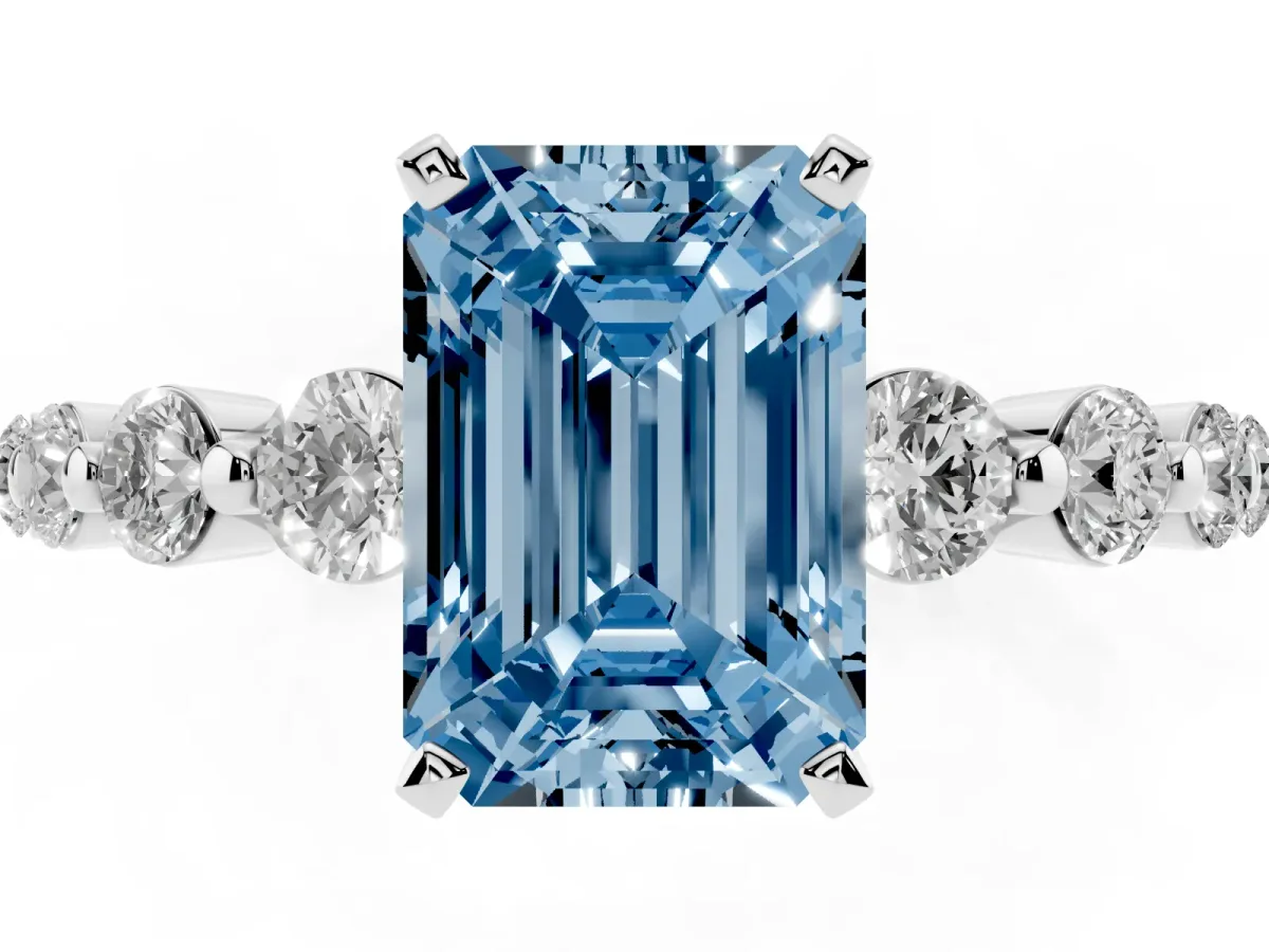 Fancy Blue Emerald Cut Solitaire Diamond Ring with Pave Band and Four-Prong Setting Silver