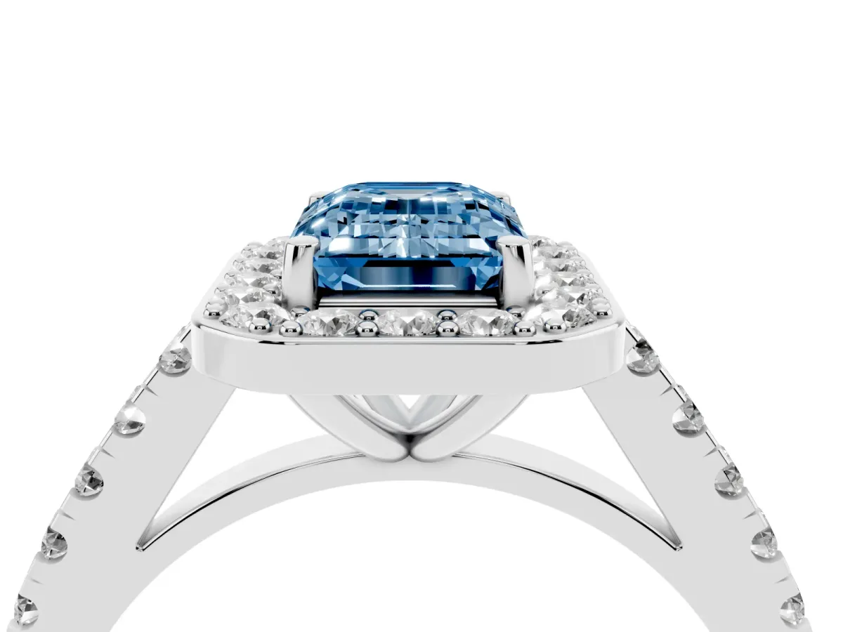 Fancy Blue Emerald Cut Diamond Halo Ring with Round Pavé Split Shank and Prong Setting Platinum