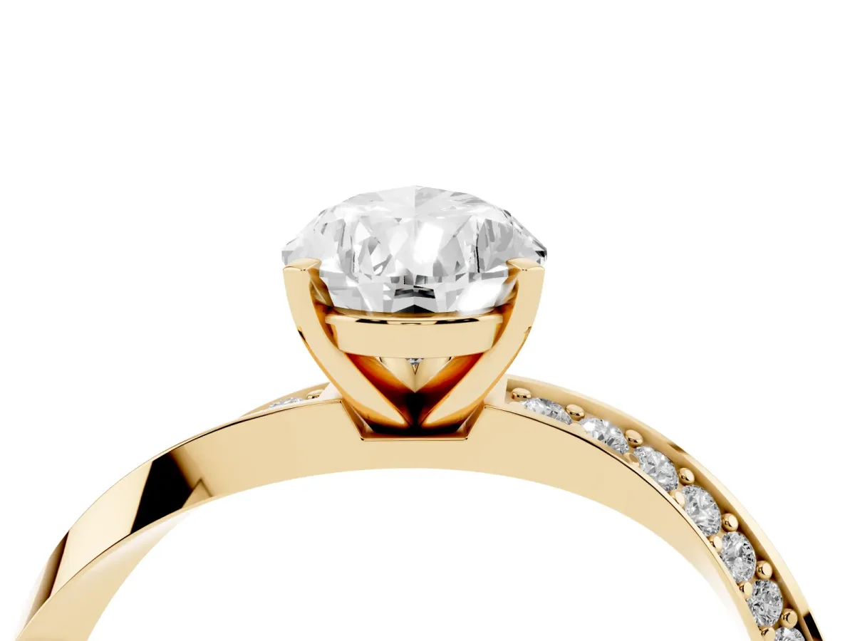 Pear Cut Diamond Engagement Ring with Side Stone Accents and Four-Prong Setting Yellow gold