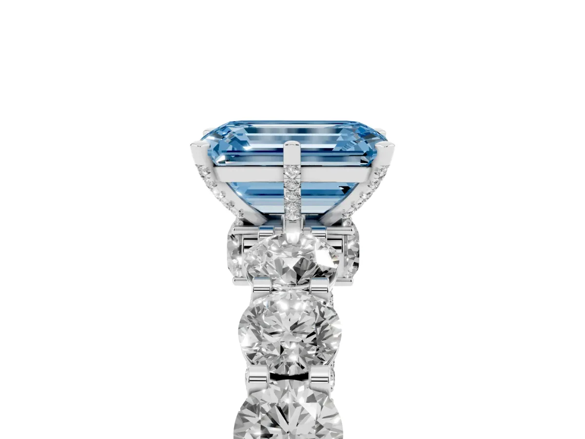 Fancy Blue Emerald Cut Diamond Side Stone Engagement Ring with Four-Prong Setting Silver