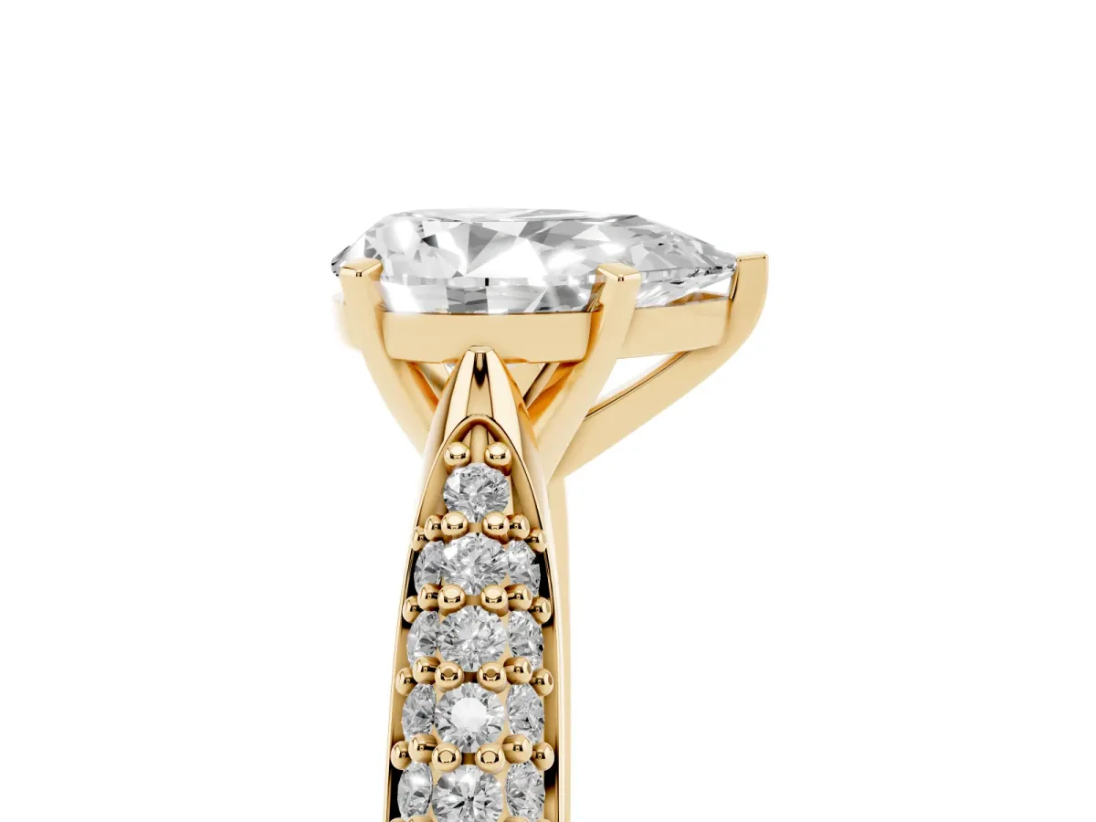 Pear Cut Diamond Solitaire Engagement Ring with Multi-Row Round Pavé Band and Prong Setting Yellow gold