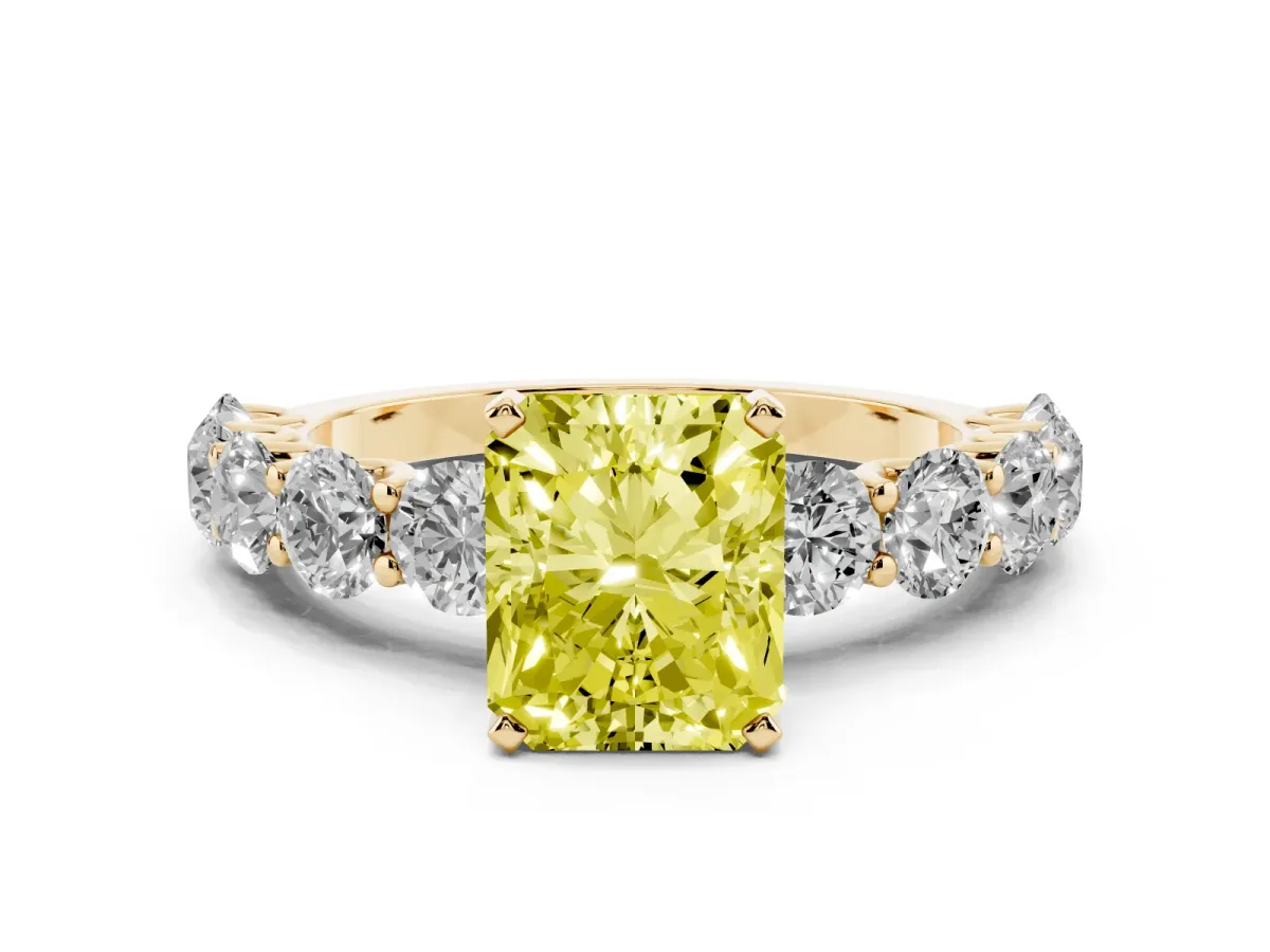 Fancy Yellow Radiant Cut Diamond Prong Setting with Side Stones on a Pave Band Yellow gold