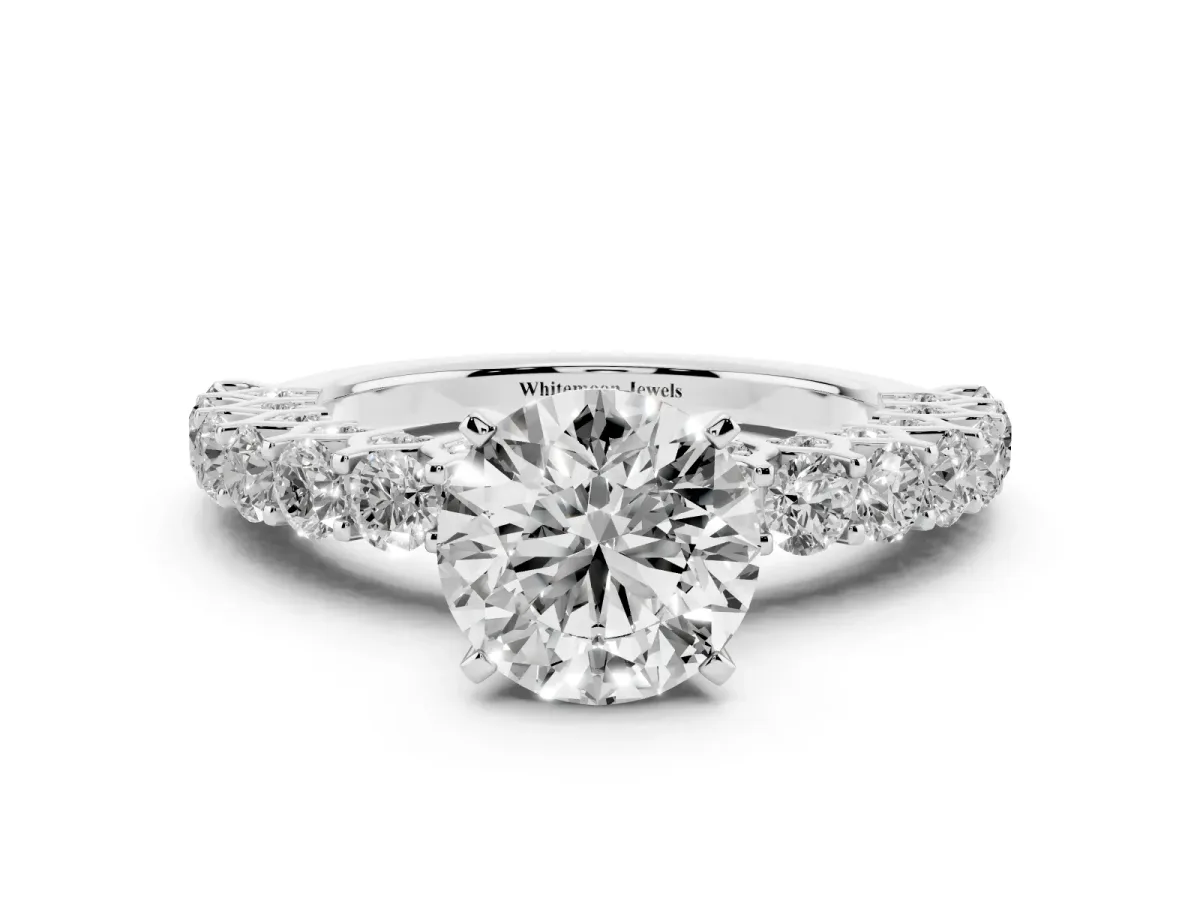 Round Cut Diamond Solitaire Ring with Shared Prong Pavé Band and Four-Prong Setting Silver