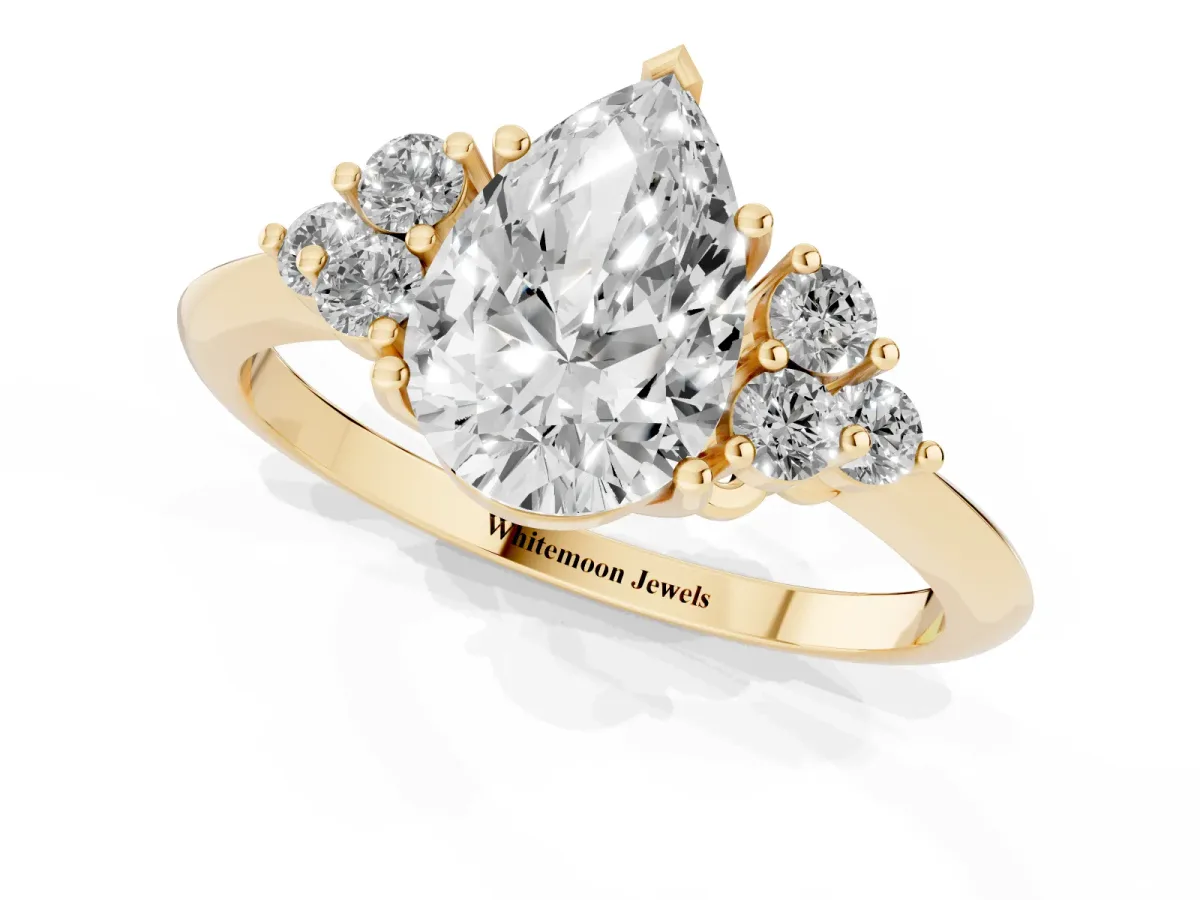 Pear Cut Cut Diamond Cluster Ring with Solitaire Band and Four-Prong Setting Yellow gold