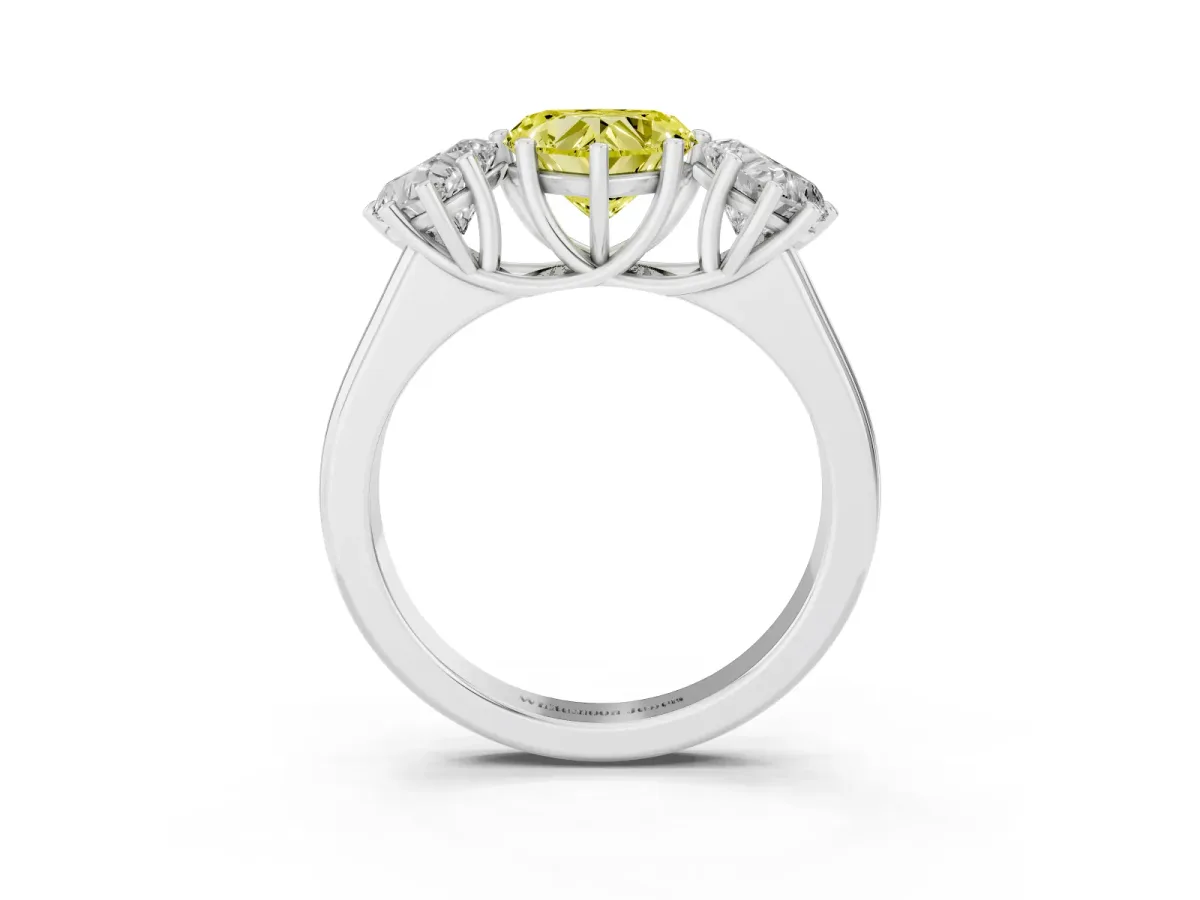 Fancy Yellow Heart Cut Three-Stone Diamond Ring with Prong Setting on a Classic Band Silver