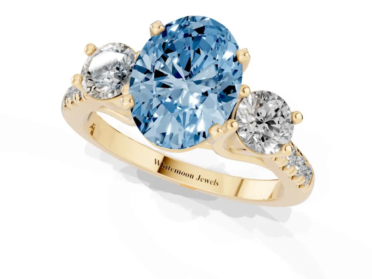 Fancy Blue Three-Stone Oval Cut Diamond Pavé Band with Four-Prong Setting Yellow gold