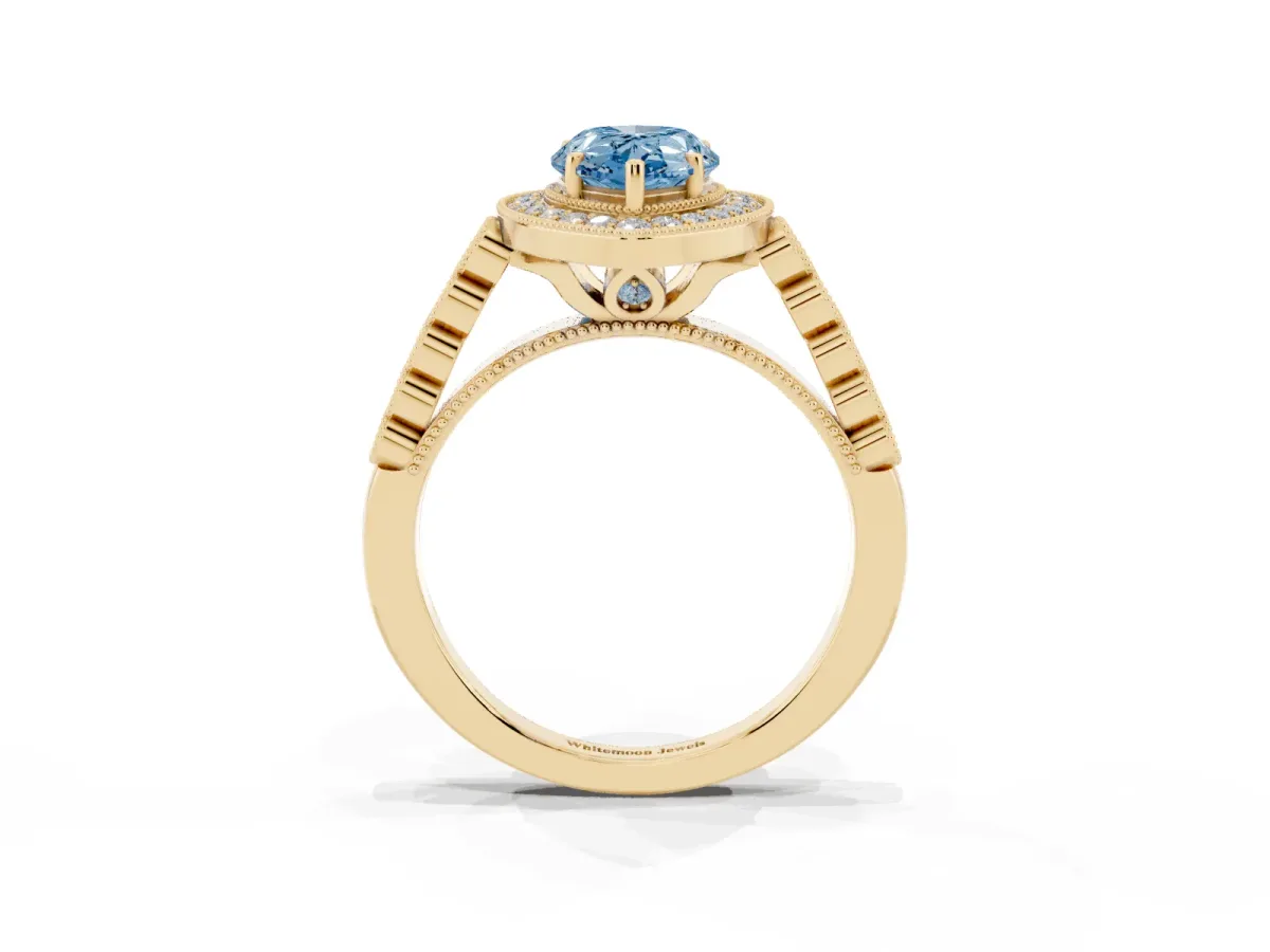 Fancy Blue Pear Cut Halo Milgrain Solitaire with Bezel Set Side Stones and Pave Band Yellow gold