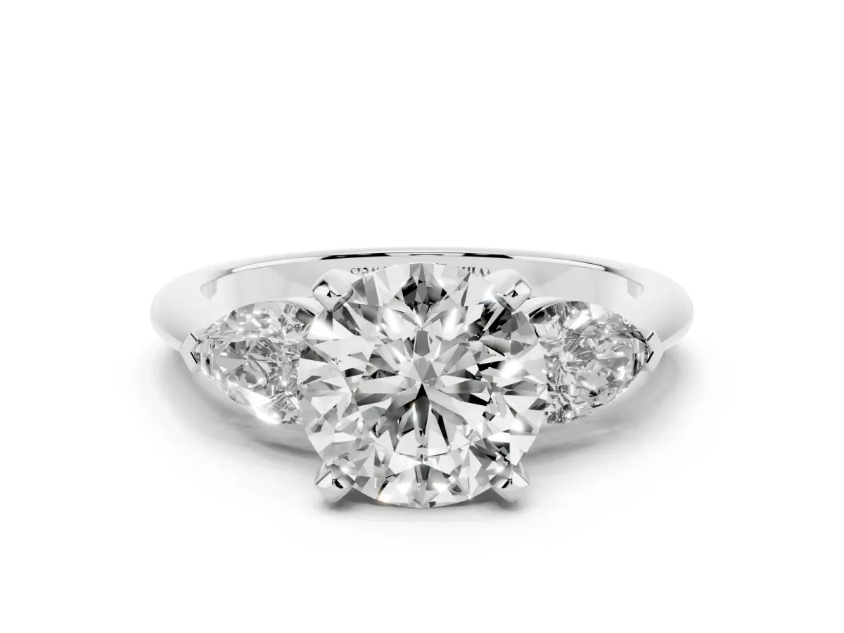 Three-Stone Round Cut Diamond Ring with Pear Side Stones and Four-Prong Setting Silver