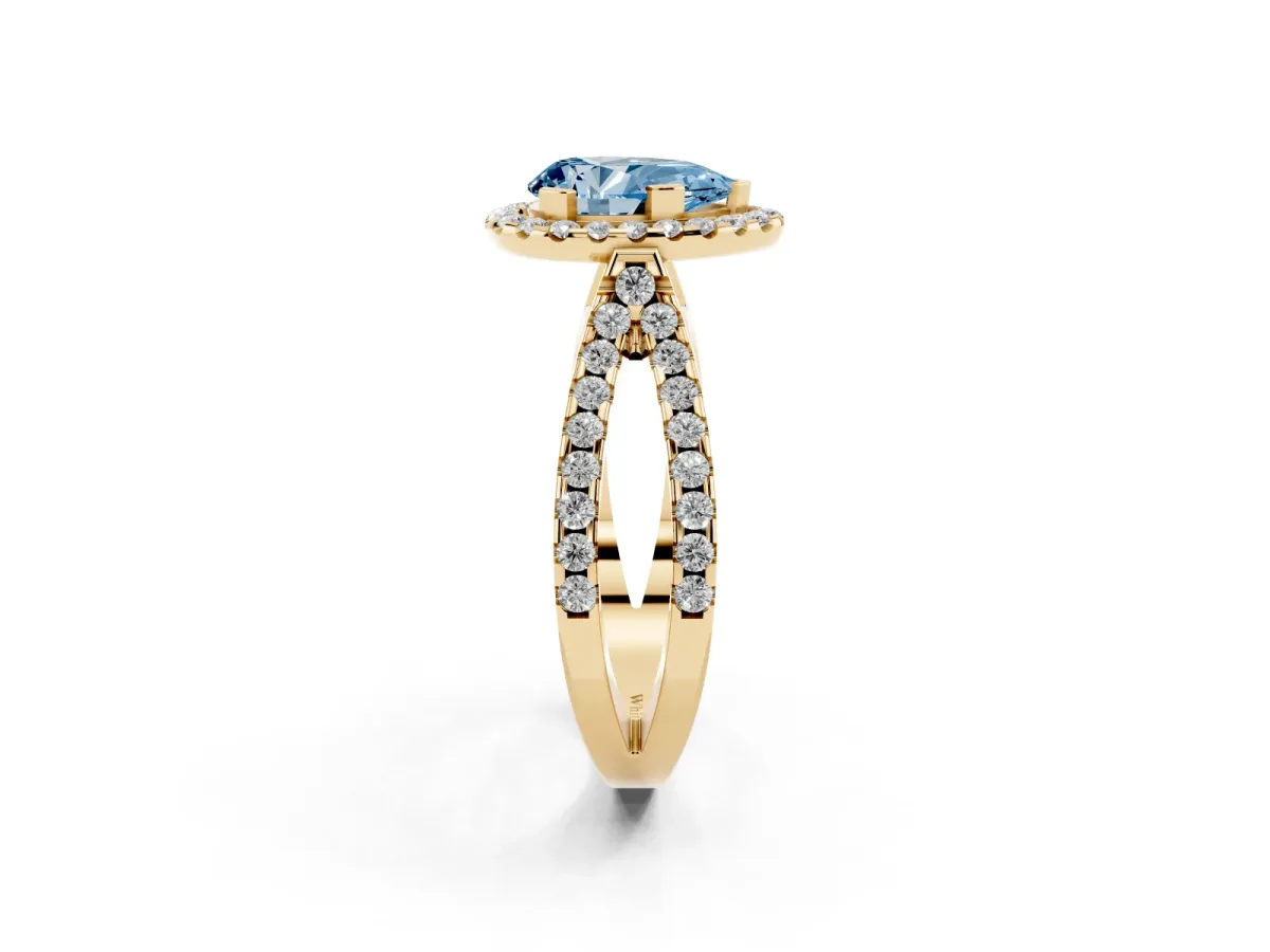 Fancy Blue Pear Cut Diamond Halo Ring with Split Shank Pavé Band and Prong Setting Yellow gold