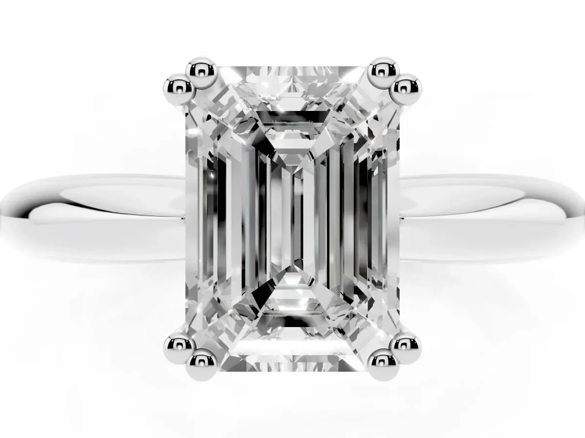 Emerald Cut Cut Solitaire Engagement Ring with Tapered Band and Four-Prong Setting Silver