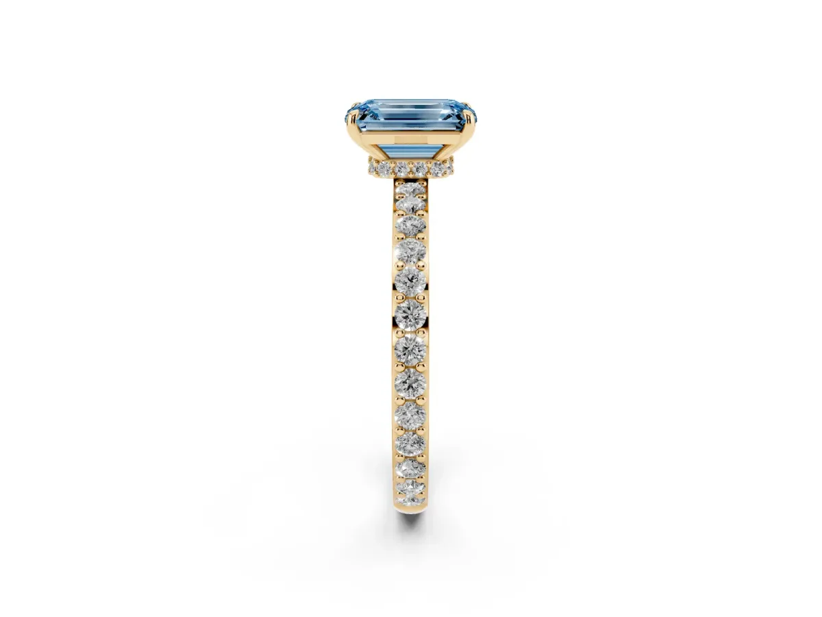 Fancy Blue Emerald Cut Diamond Solitaire Engagement Ring with Pavé Band and Four-Prong Setting Yellow gold