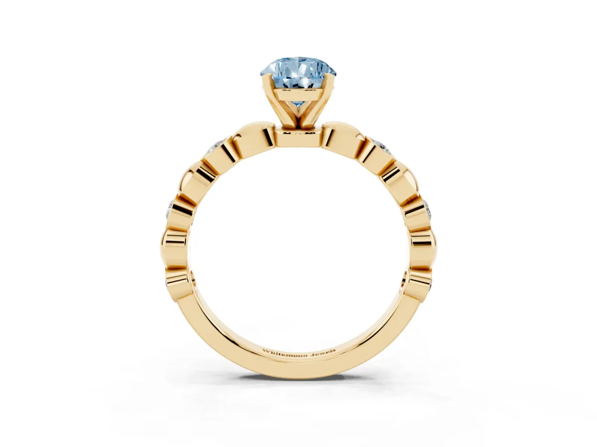 Fancy Blue Pear Cut Solitaire Bezel-Set Diamond Ring with Beaded Band and Four-Prong Setting Yellow gold