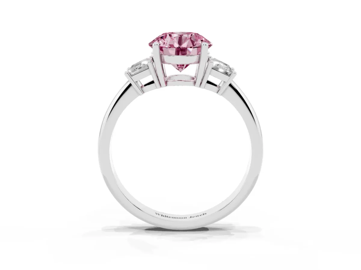 Fancy Pink Round Cut Diamond Three-Stone Ring with Trapezoid Side Stones and Prong Setting Platinum