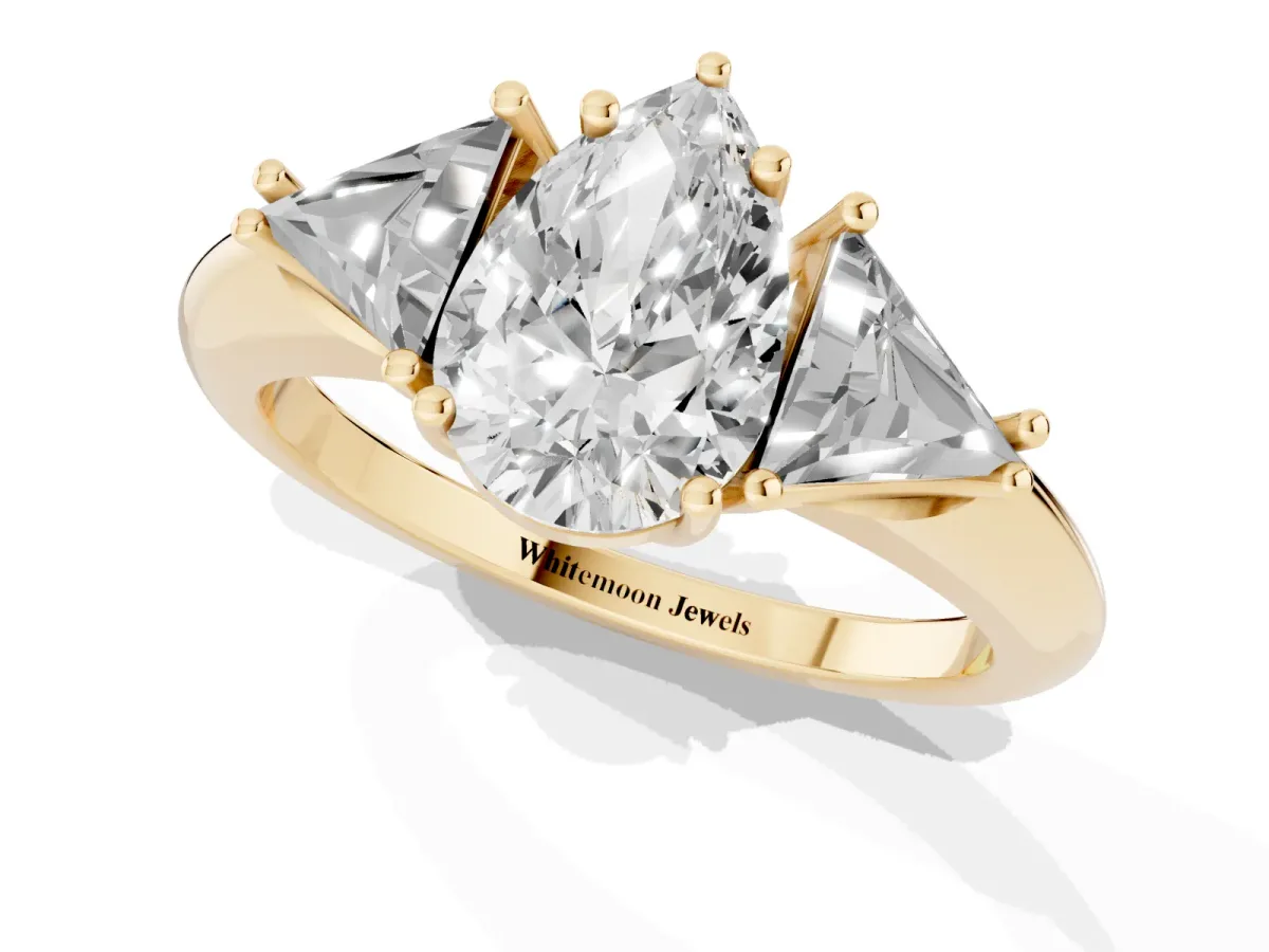 Three-Stone Pear Cut Diamond Engagement Ring with Trillion Side Stones and Prong Setting Yellow gold