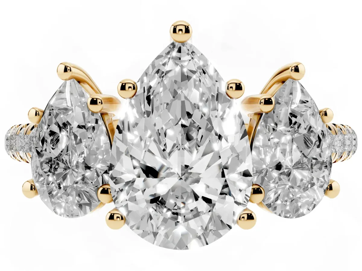 Three-Stone Pear Cut Diamond Ring with Round Pavé Band and Prong Setting Yellow gold