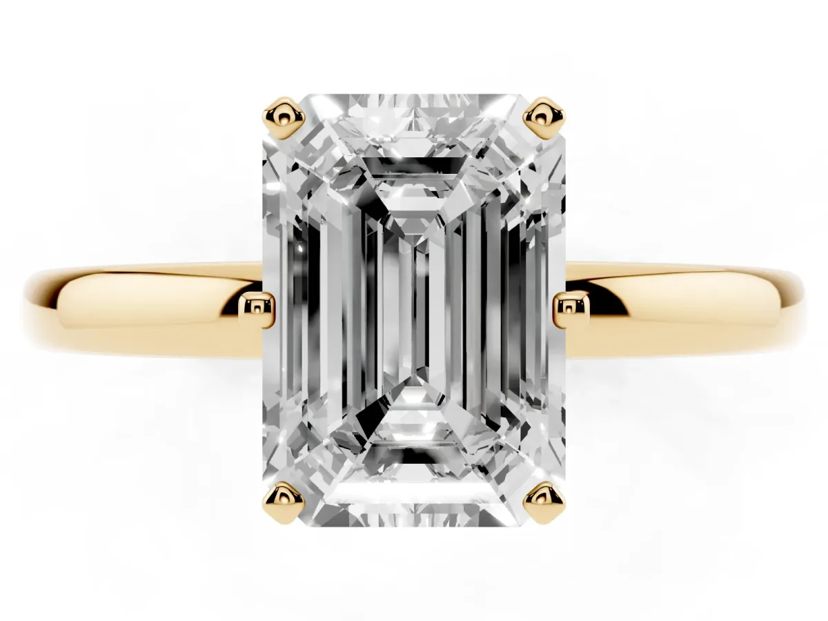 Emerald Cut Solitaire Diamond Ring with Six-Prong Setting on a Classic Band Yellow gold