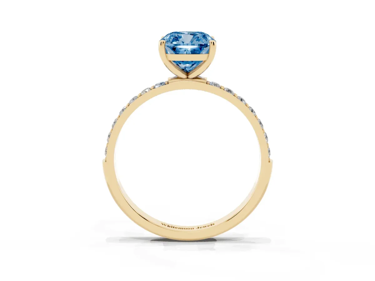 Fancy Blue Cushion Cut Diamond Solitaire Ring with Round Pavé Shoulders and Prong Setting Yellow gold