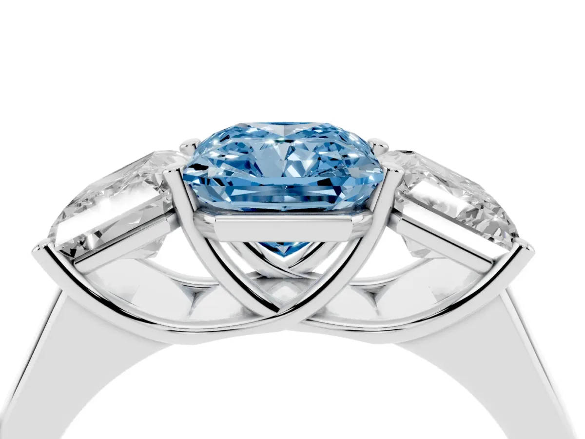 Fancy Blue Radiant Cut Three-Stone Diamond Ring with Prong Setting on a Classic Band Platinum