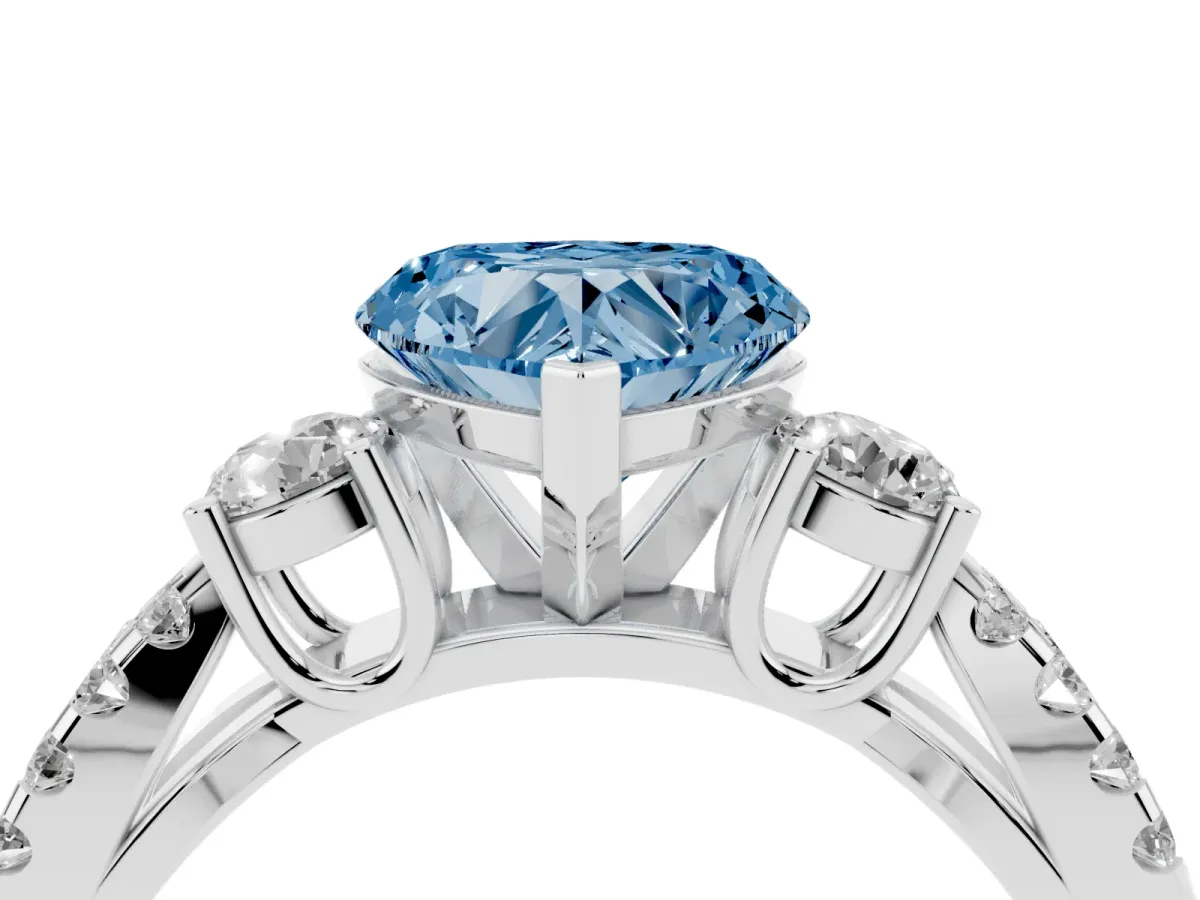 Fancy Blue Heart Cut Diamond Three-Stone Ring with Pavé Split Shank and Four-Prong Setting Silver