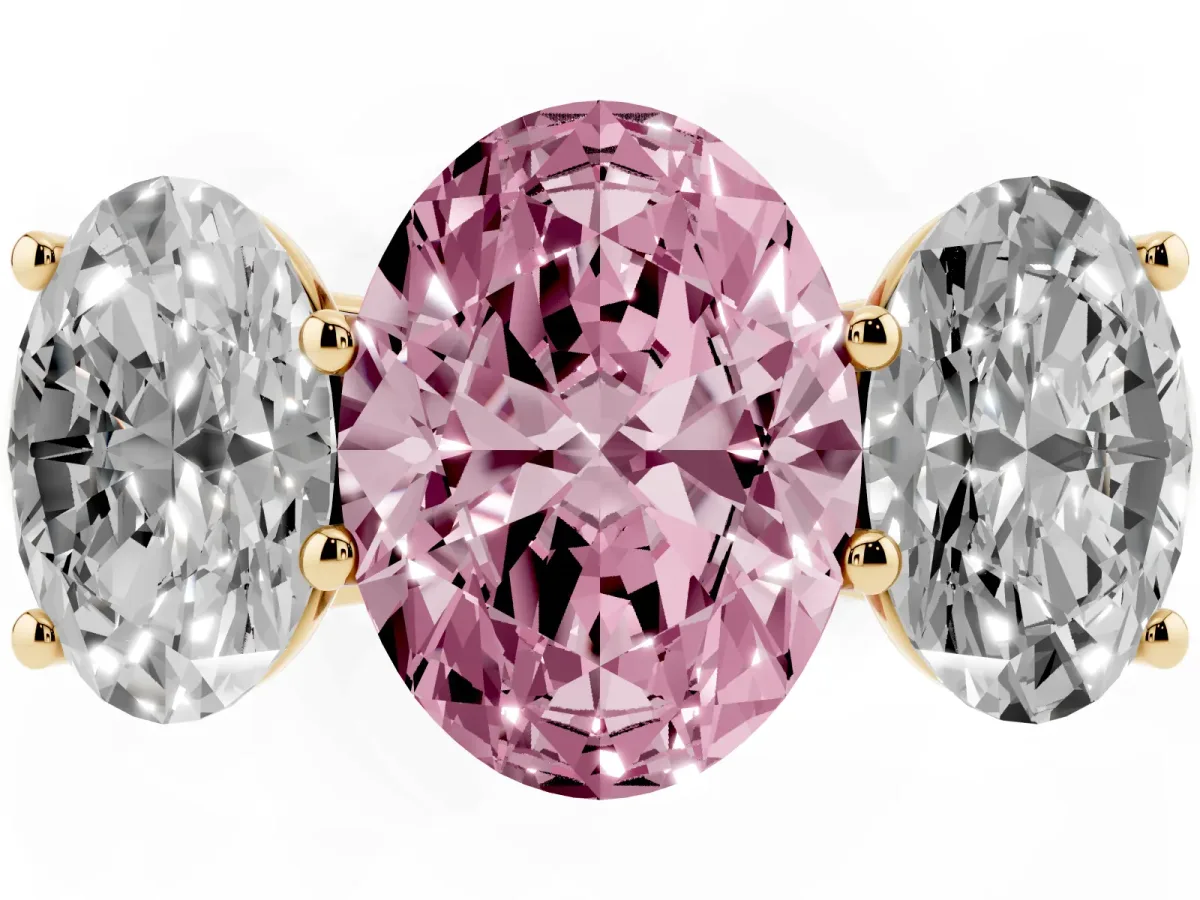 Fancy Pink Oval Cut Three-Stone Diamond Ring with Prong Setting on a Classic Band Yellow gold