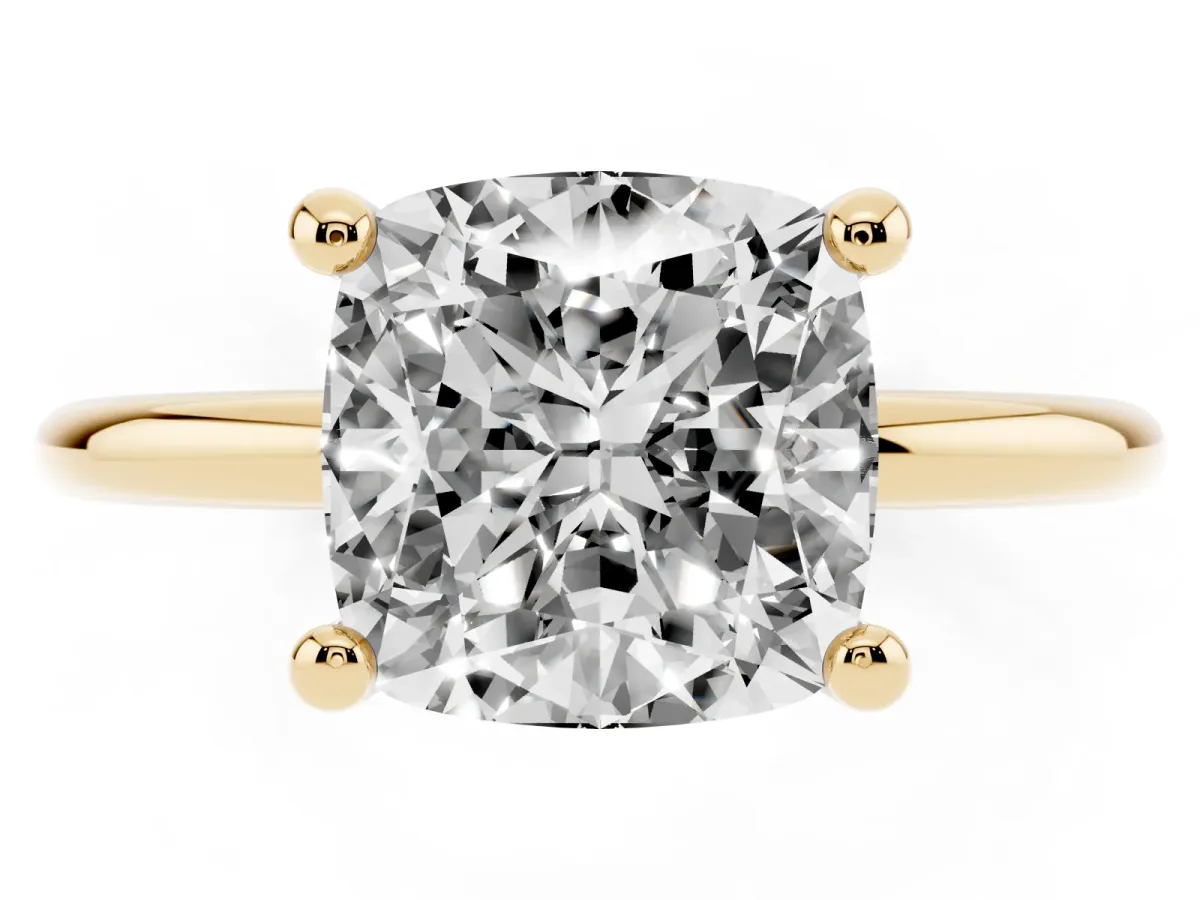 Cushion Cut Solitaire Diamond Ring with 4-Prong Setting on a Classic Band Yellow gold