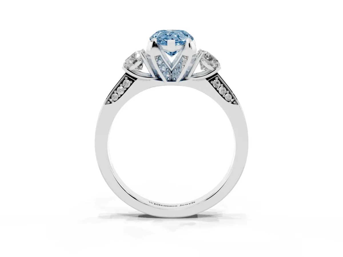 Fancy Blue Pear Cut Brilliant Three-Stone Diamond Ring with Pavé Band and Four-Prong Setting Silver