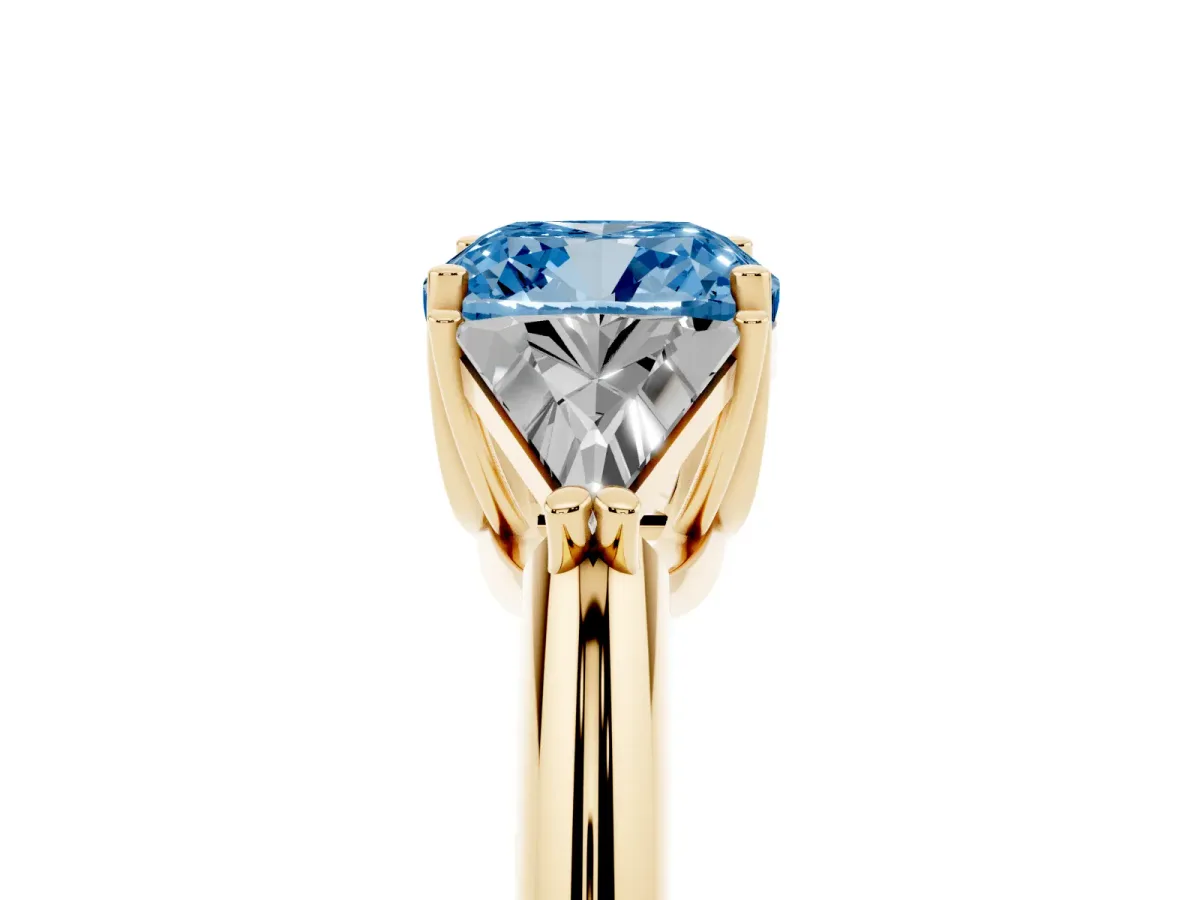 Fancy Blue Three-Stone Cushion Cut Diamond Engagement Ring with Trillion Side Stones and Prong Setting Yellow gold