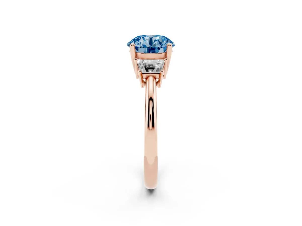 Fancy Blue Round Cut Diamond Three-Stone Ring with Trapezoid Side Stones and Prong Setting Rose gold