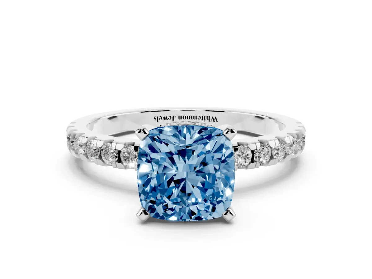 Fancy Blue Cushion Cut Diamond Solitaire Ring with Round Pavé Band and Four-Prong Setting Silver