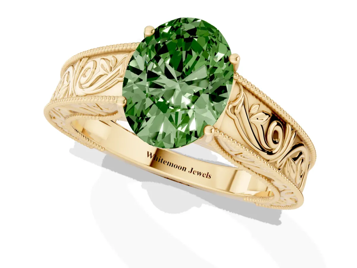 Fancy Green Oval Cut Diamond Solitaire Ring with Engraved Band and Four-Prong Setting Yellow gold