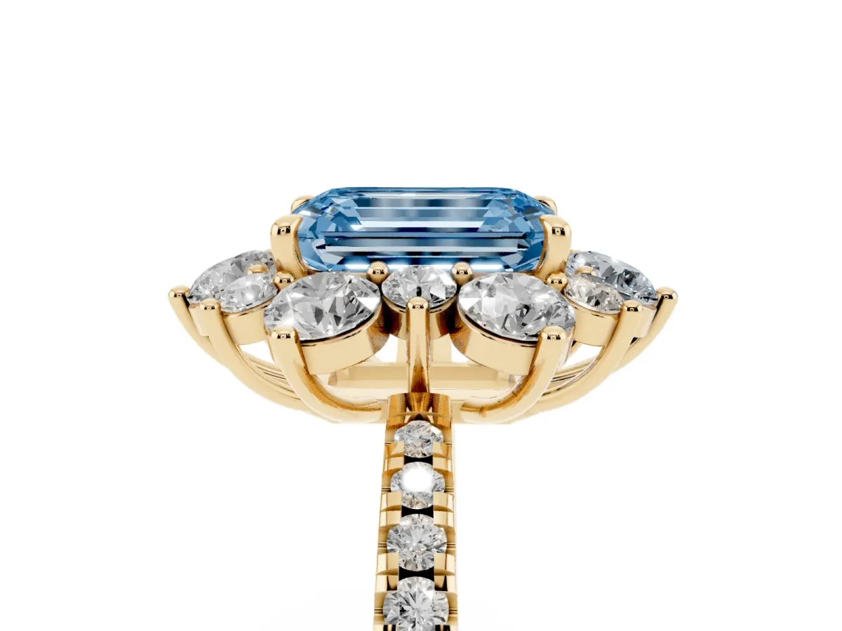 Fancy Blue Emerald Cut Diamond Floral Halo Ring with Round Pavé Band and Prong Setting Yellow gold