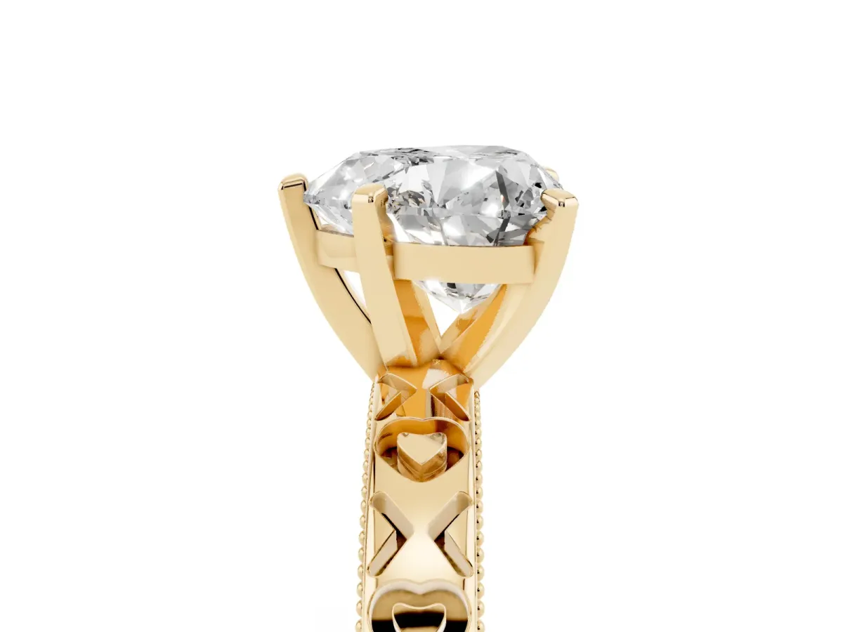 Heart Cut Solitaire Diamond Engagement Ring with XO Engraved Band and Four-Prong Setting Yellow gold