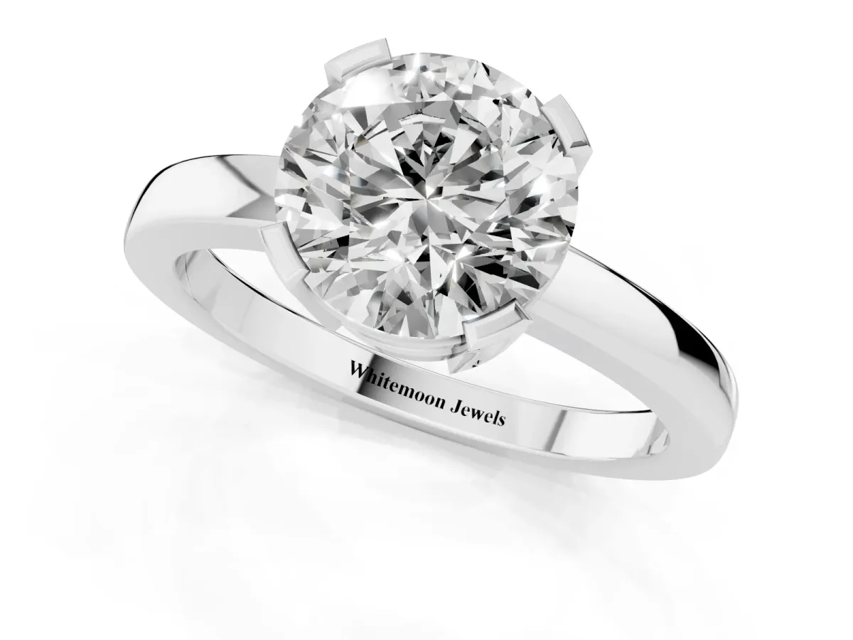 Round Cut Cut Solitaire Ring with Four-Prong Setting and Classic Band Silver