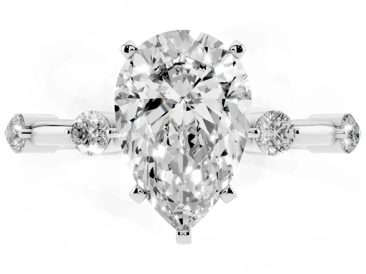 Pear Cut Solitaire Diamond Ring with Bezel Set Side Stones and Prong Setting White gold