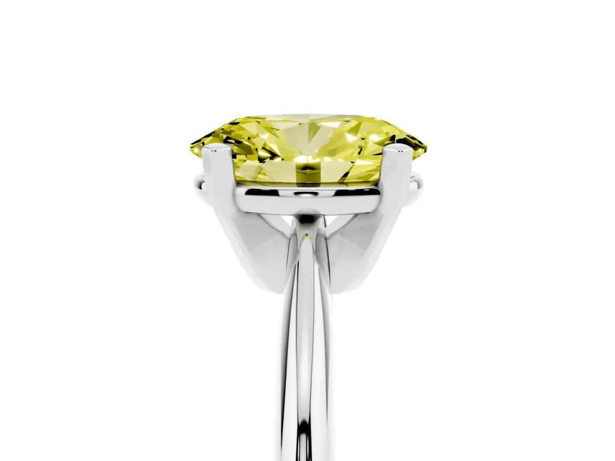 Fancy Yellow Oval Cut Cut Solitaire Ring with Four-Prong Setting on a Classic Band Platinum