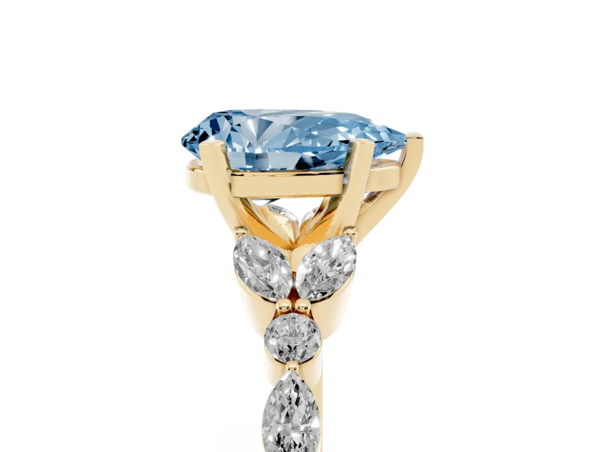 Fancy Blue Pear Cut Diamond Solitaire Ring with Side Stones and Four-Prong Setting Yellow gold