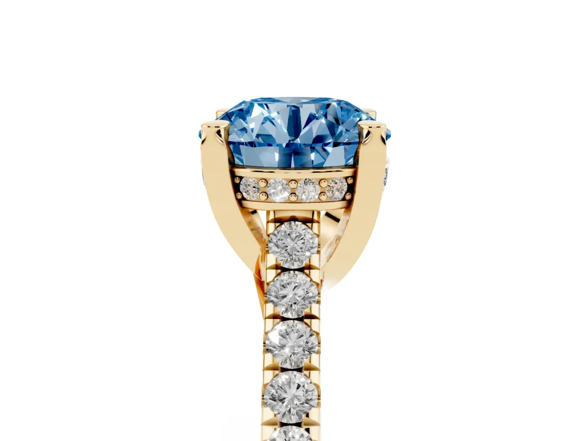 Fancy Blue Round Cut Brilliant Diamond Solitaire with Pavé Band and Four-Prong Setting Yellow gold