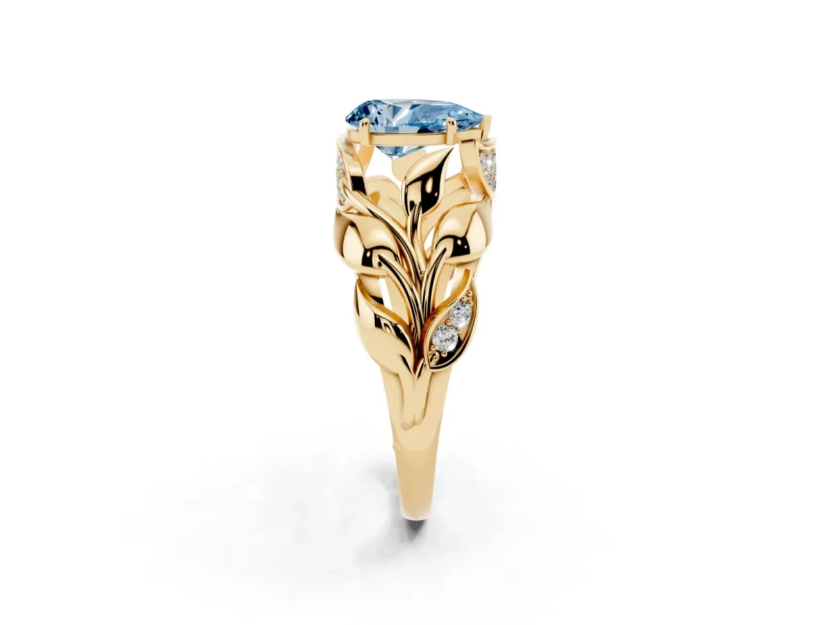 Fancy Blue Pear Cut Diamond Leaf-Inspired Engagement Ring with Round Accents and Prong Setting Yellow gold